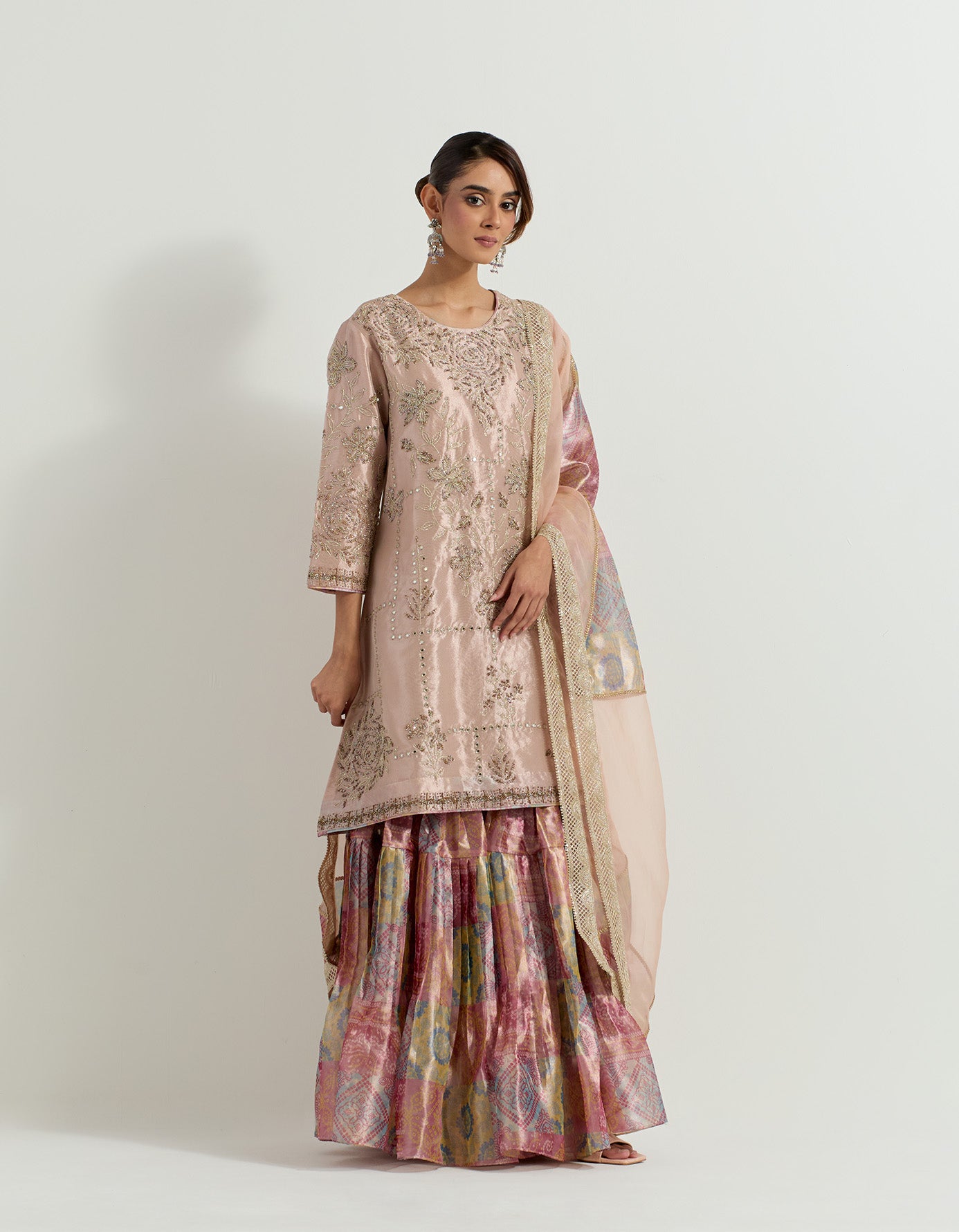 Tissue hand embellished long tunic paired with tissue bandhini printed  pleated sharara and organza and tissue patch work dupatta