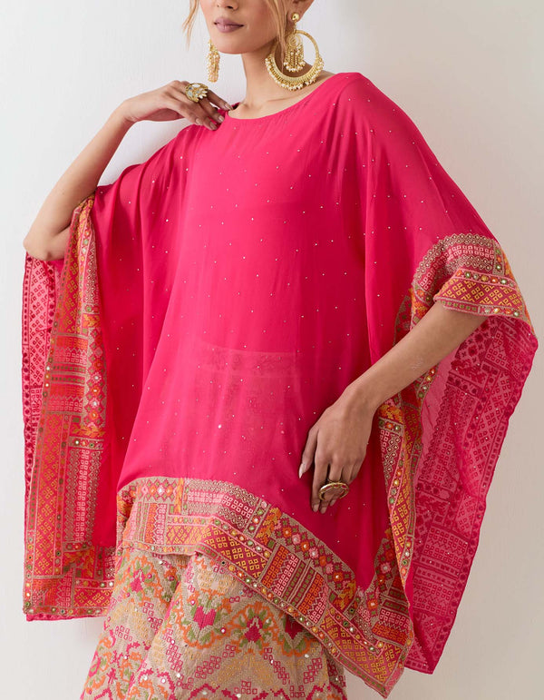 Fuchsia pink muqaish georgette  poncho cape paired with cross stitch embroidered sharara