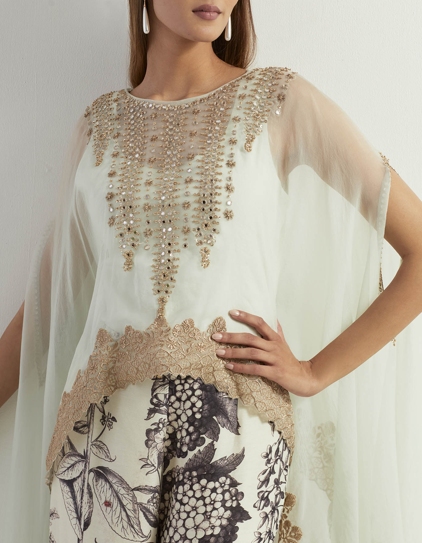 Saaya printed chanderi pants paired with organza silk hand embroidery cape and steretch inner