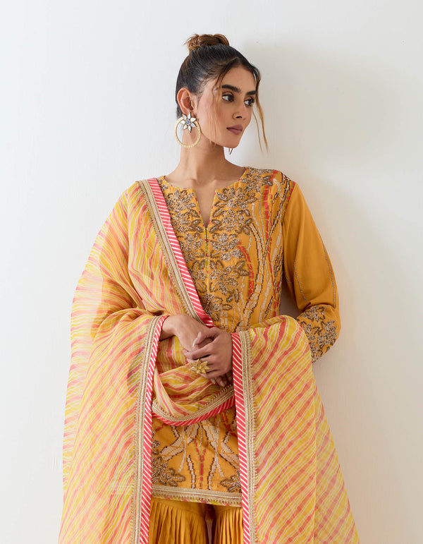 Mustard yellow sharara set in exquisite hand embroidery and tie dye dupatta