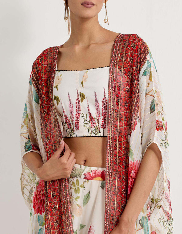 Daisy printed sharara pants paired with stretch lycra bustier and lurex georgette cape