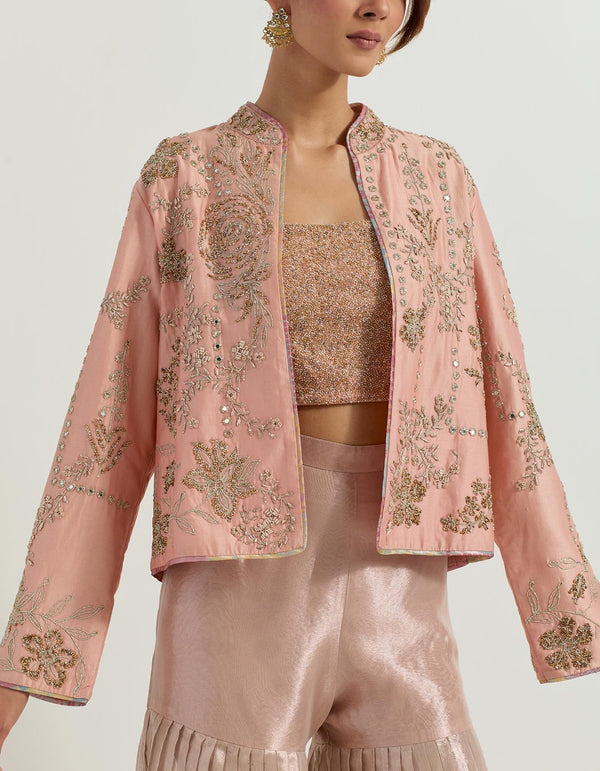 Chanderi silk hand embellished jacket paired with hand embroidered bustier and tissue pleated gharara