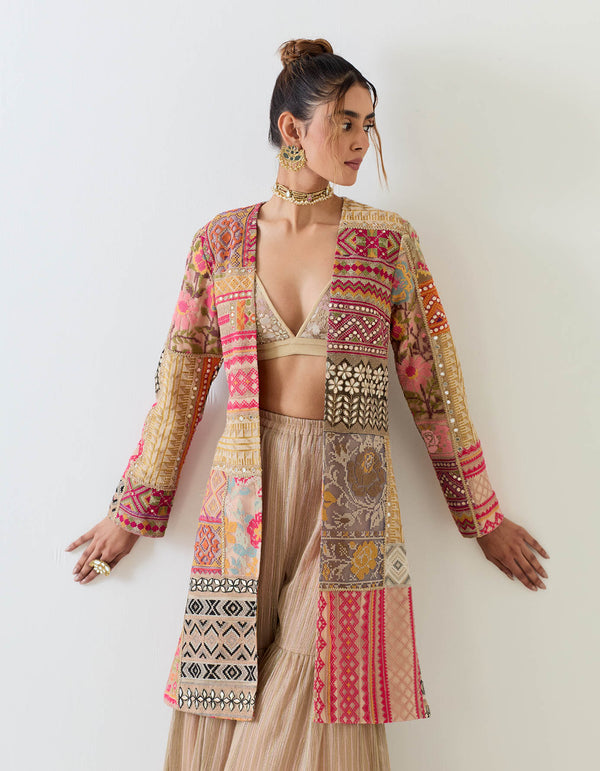 Patch work embroidered long jacket paired with textured sharara pants and patch work embroidered bralet