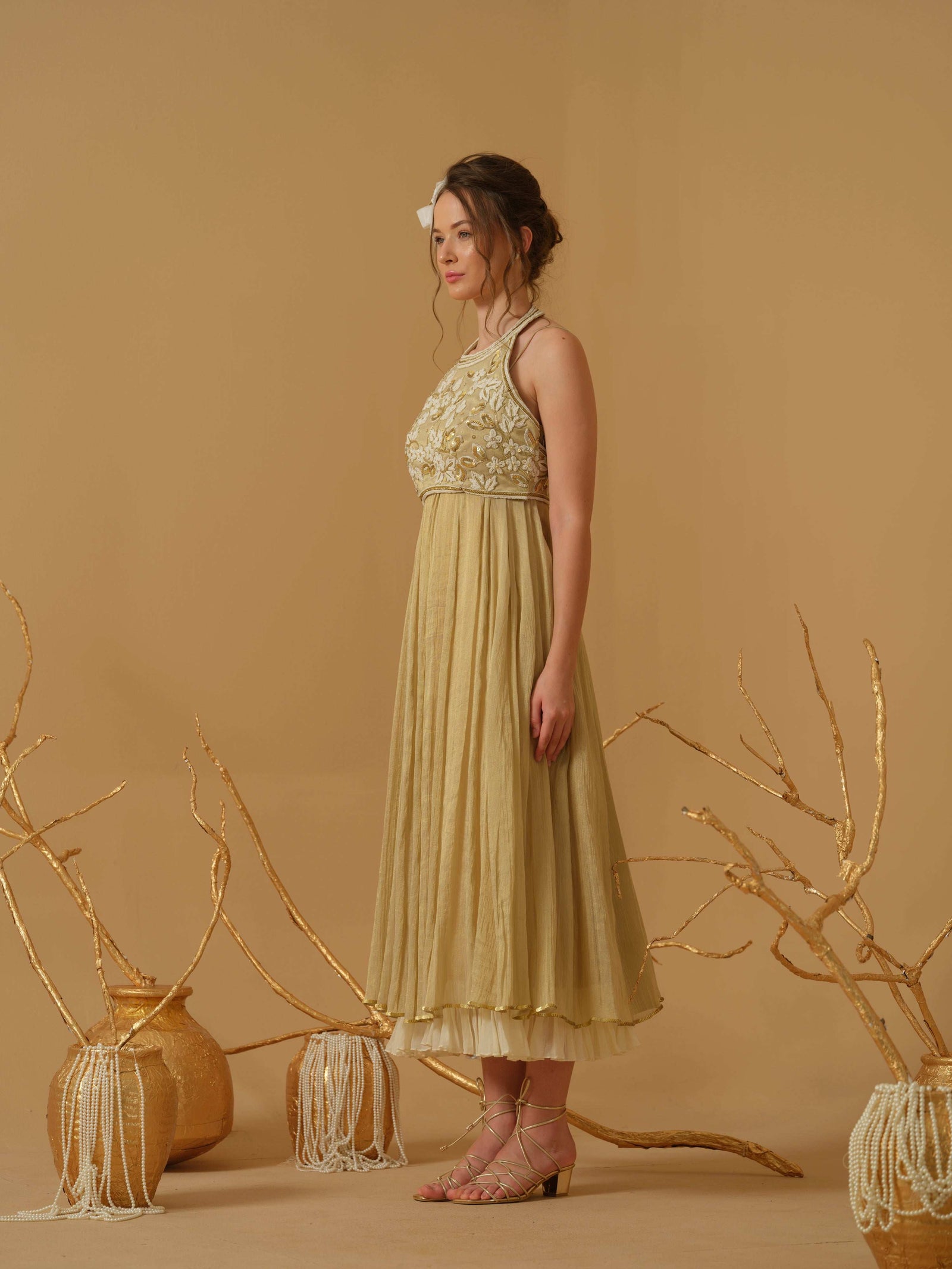 A Noodle Strap, Calf Length Flared Dress Having A Sequins Line