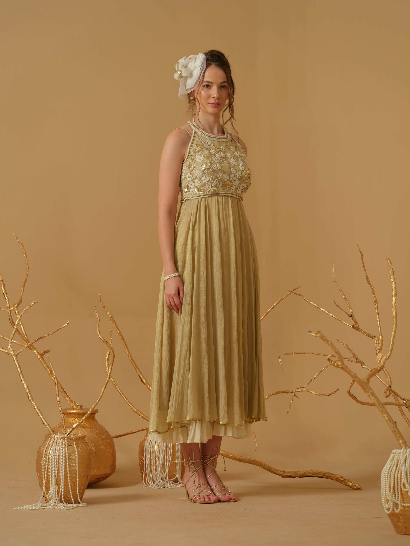 A Noodle Strap, Calf Length Flared Dress Having A Sequins Line