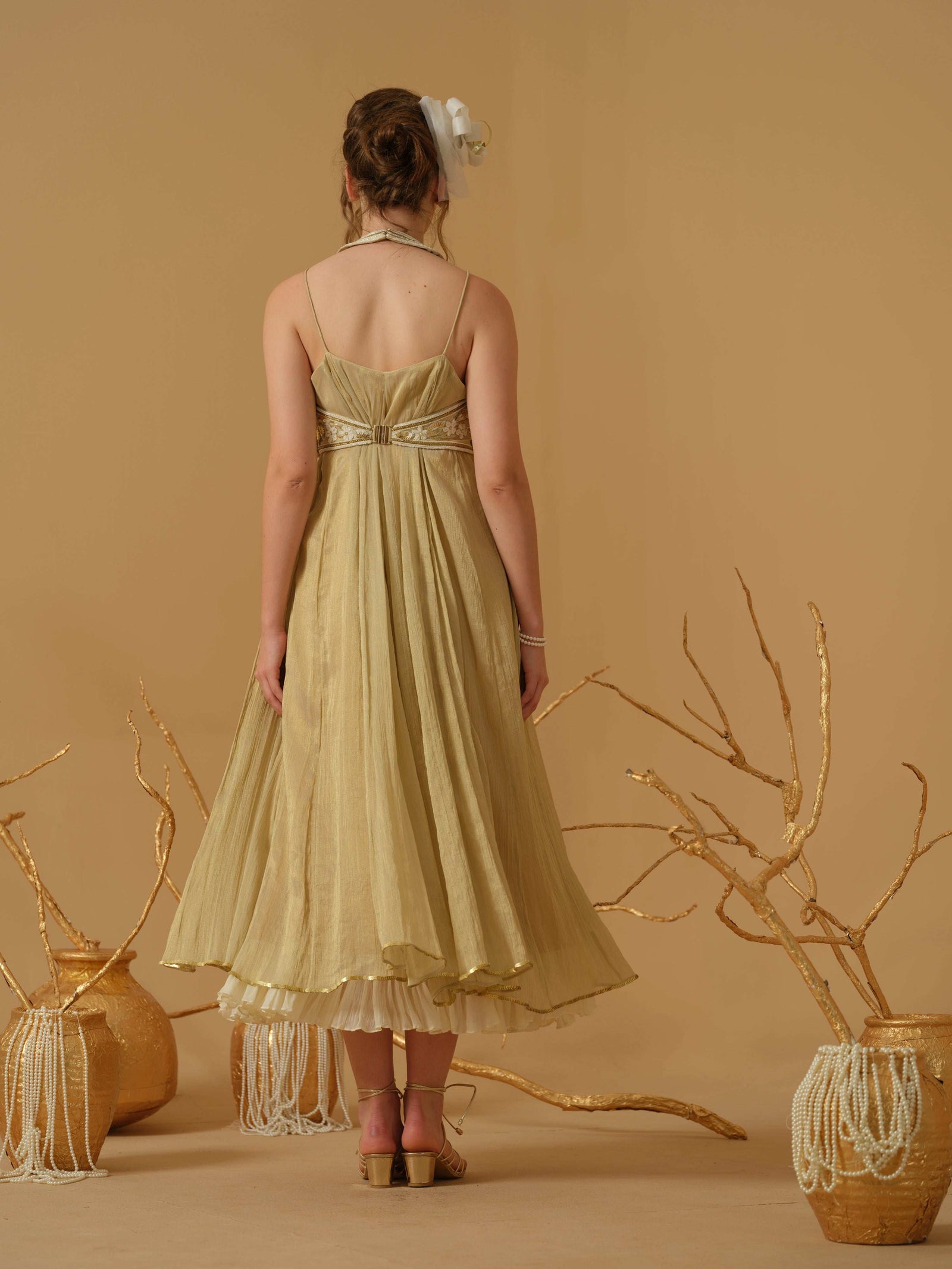 A Noodle Strap, Calf Length Flared Dress Having A Sequins Line