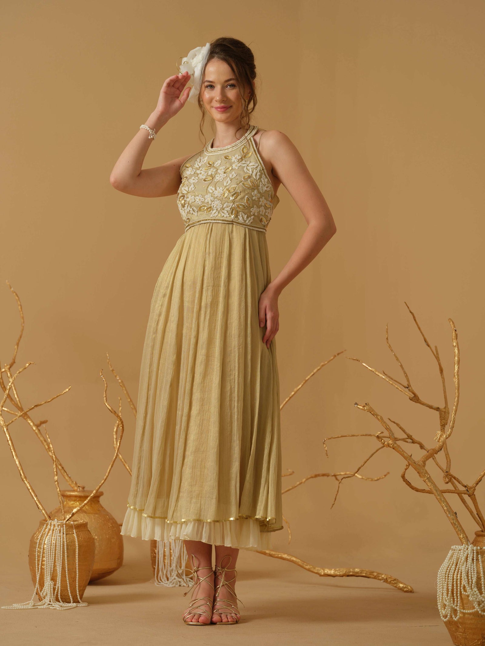 A Noodle Strap, Calf Length Flared Dress Having A Sequins Line