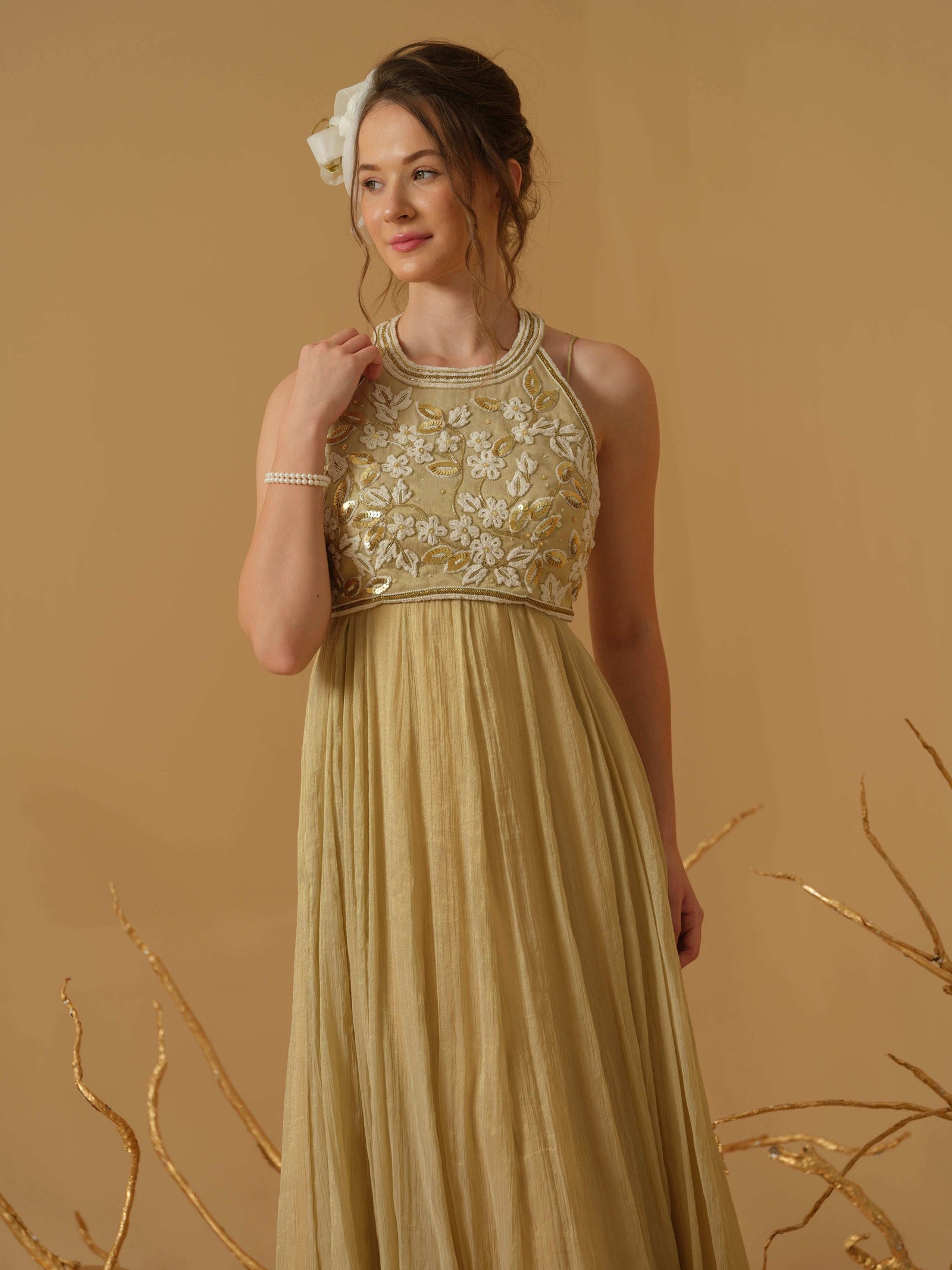 A Noodle Strap, Calf Length Flared Dress Having A Sequins Line