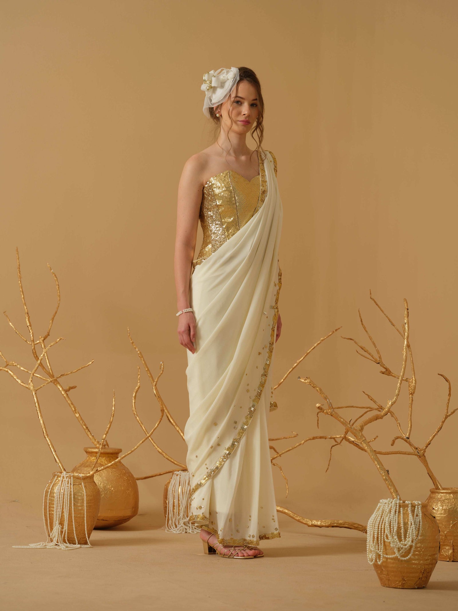 A Pre-Stitched Saree With A Geometrical Sequins Border