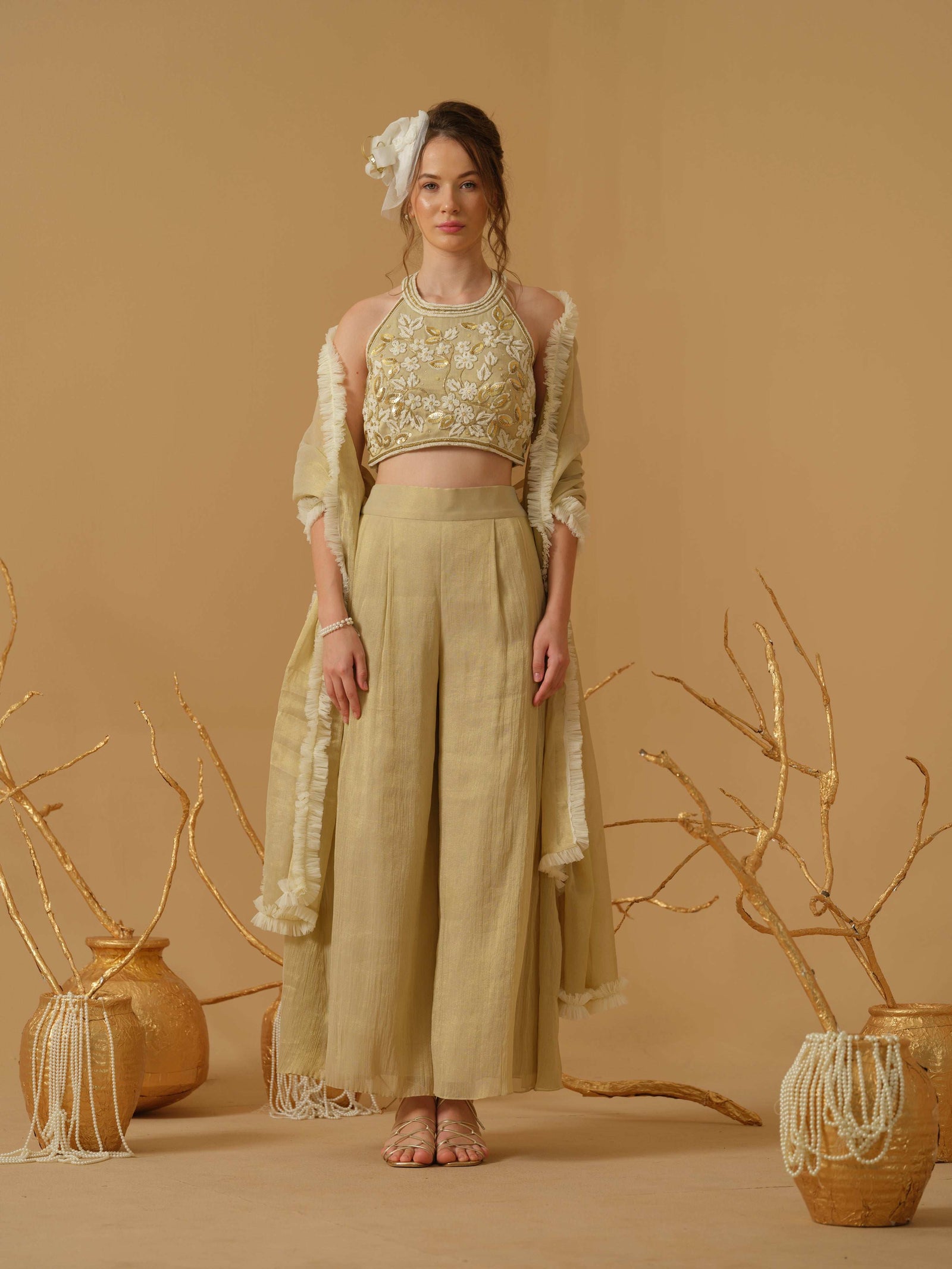 A Halter Neck Blouse Having  Floral Embroidery  Paired With Culotte Pant