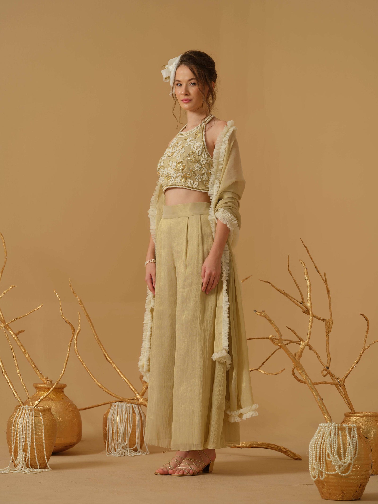 A Halter Neck Blouse Having  Floral Embroidery  Paired With Culotte Pant