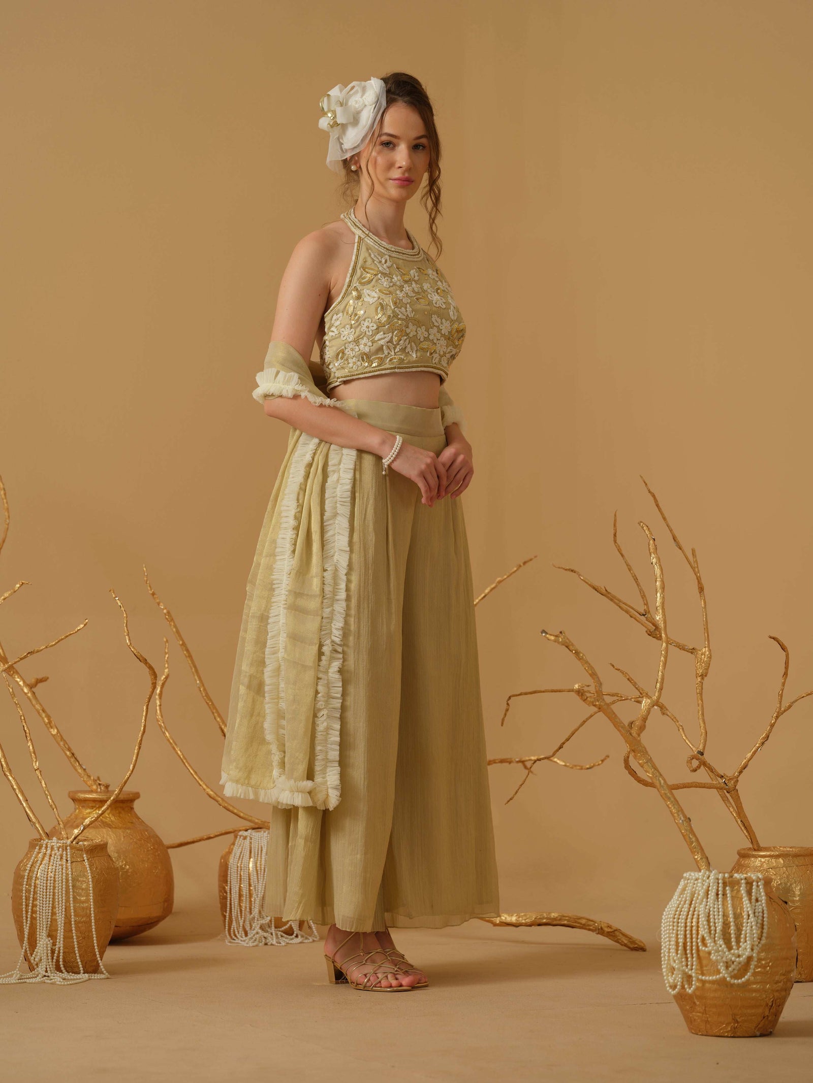 A Halter Neck Blouse Having  Floral Embroidery  Paired With Culotte Pant