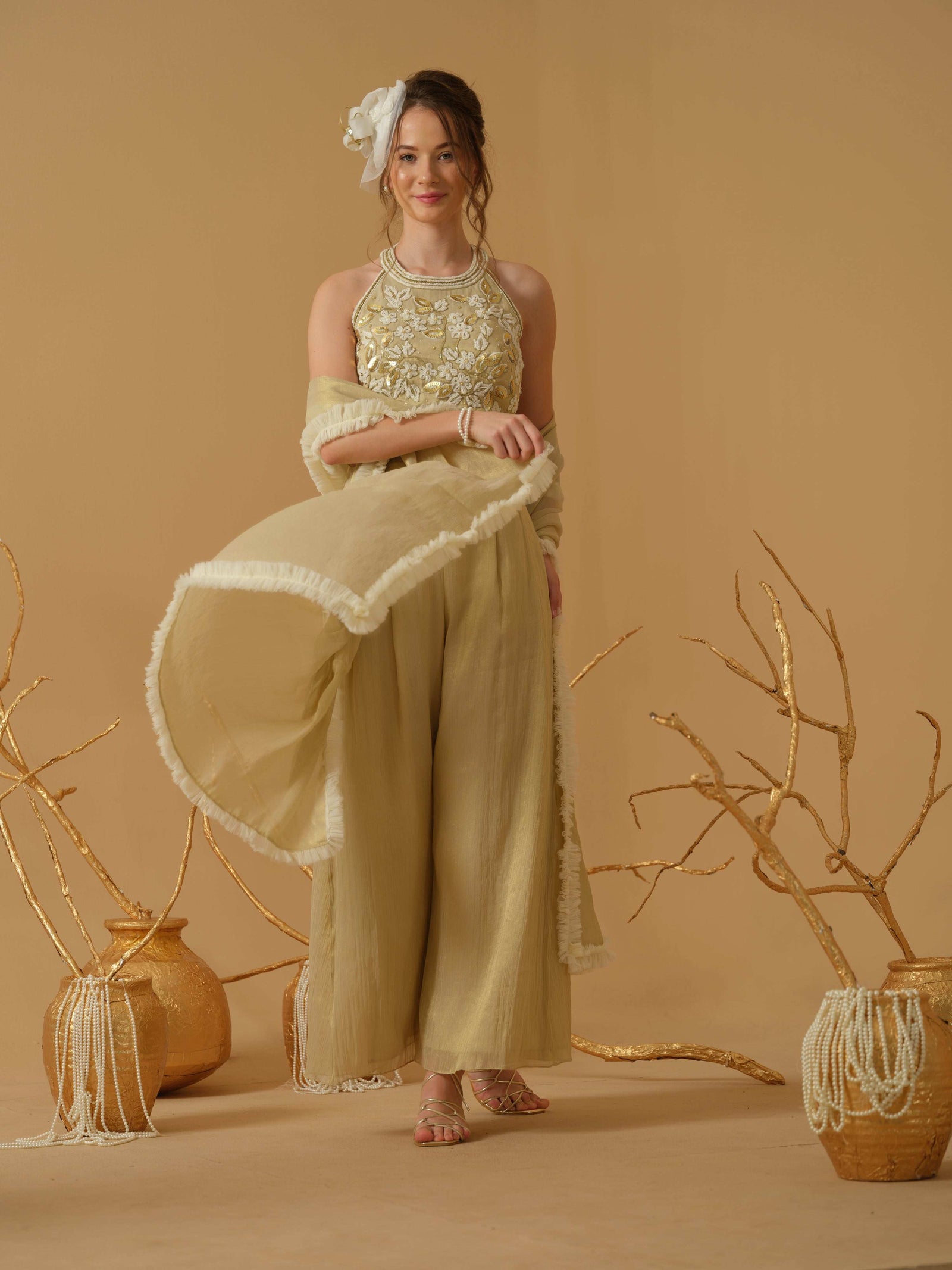 A Halter Neck Blouse Having  Floral Embroidery  Paired With Culotte Pant