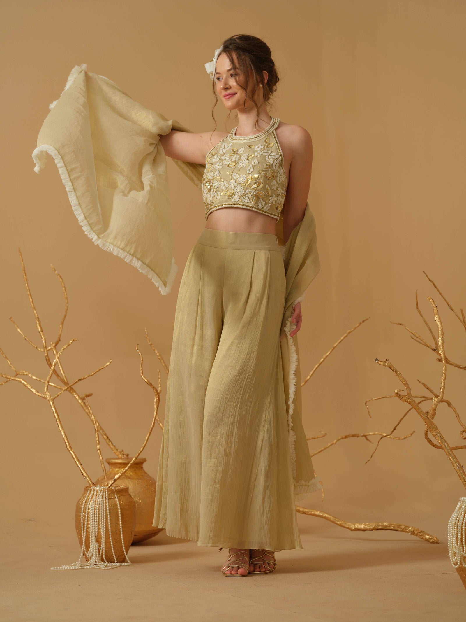 A Halter Neck Blouse Having  Floral Embroidery  Paired With Culotte Pant