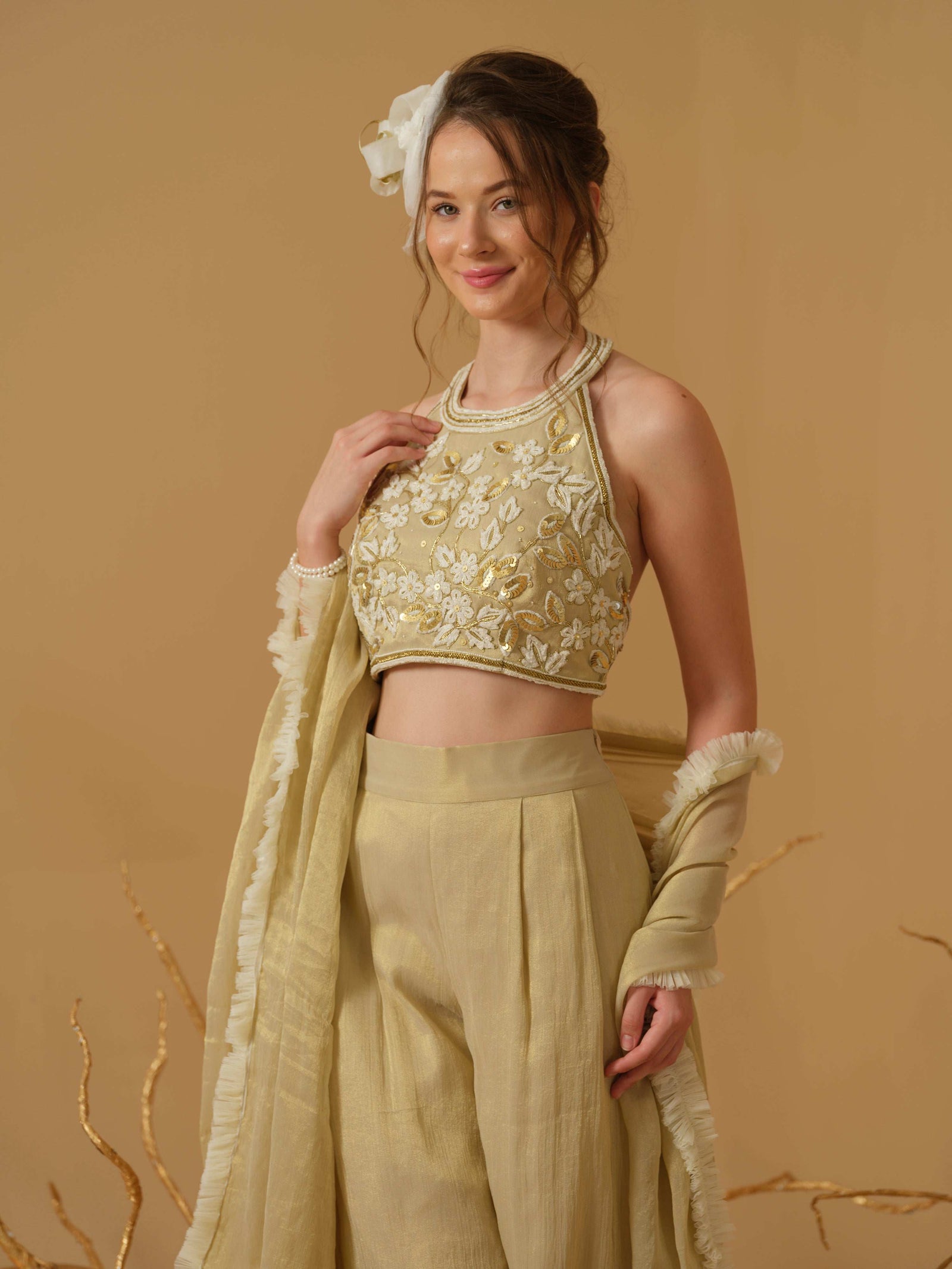 A Halter Neck Blouse Having  Floral Embroidery  Paired With Culotte Pant