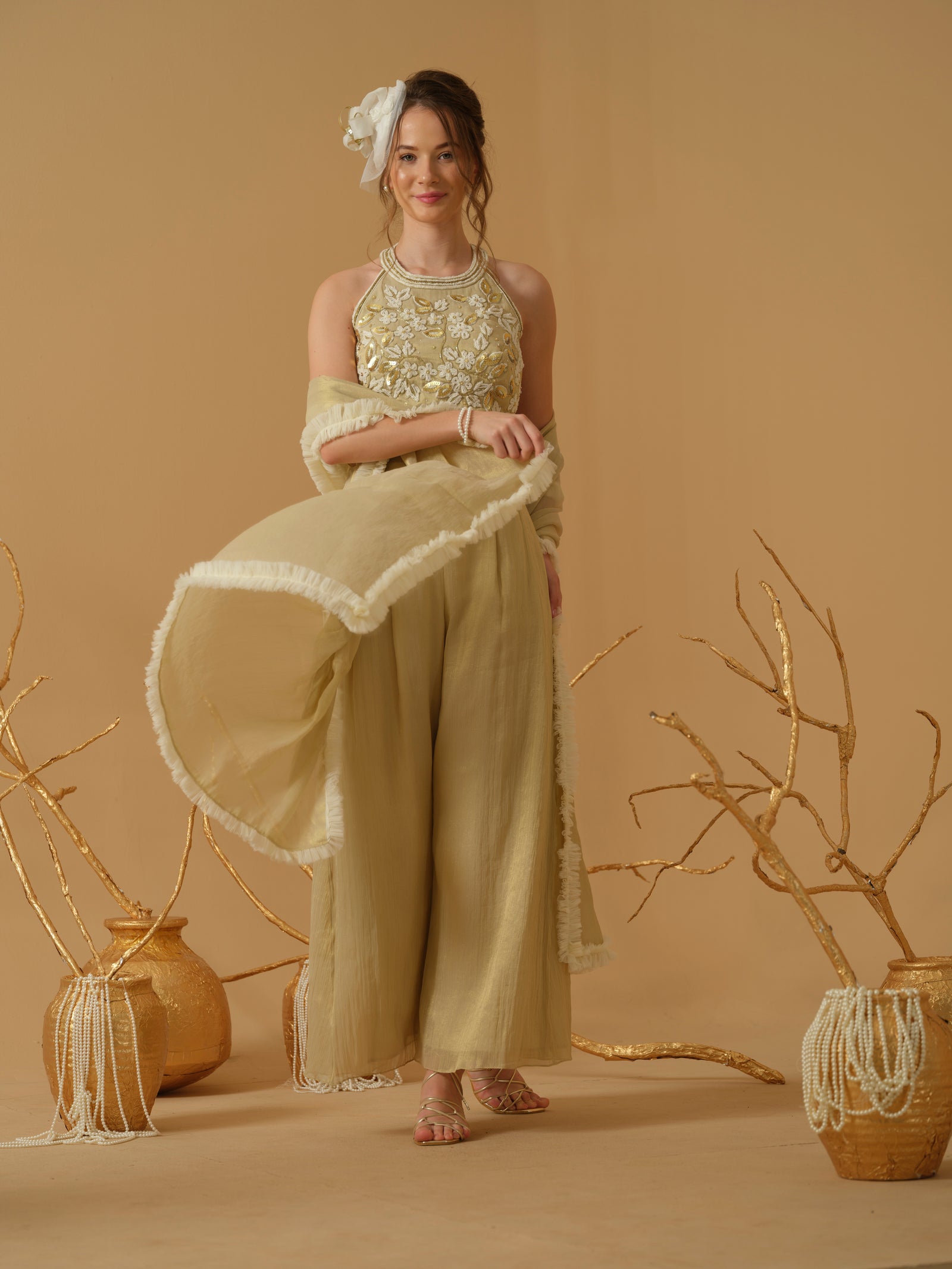 A Halter Neck Blouse Having  Floral Embroidery  Paired With Culotte Pant