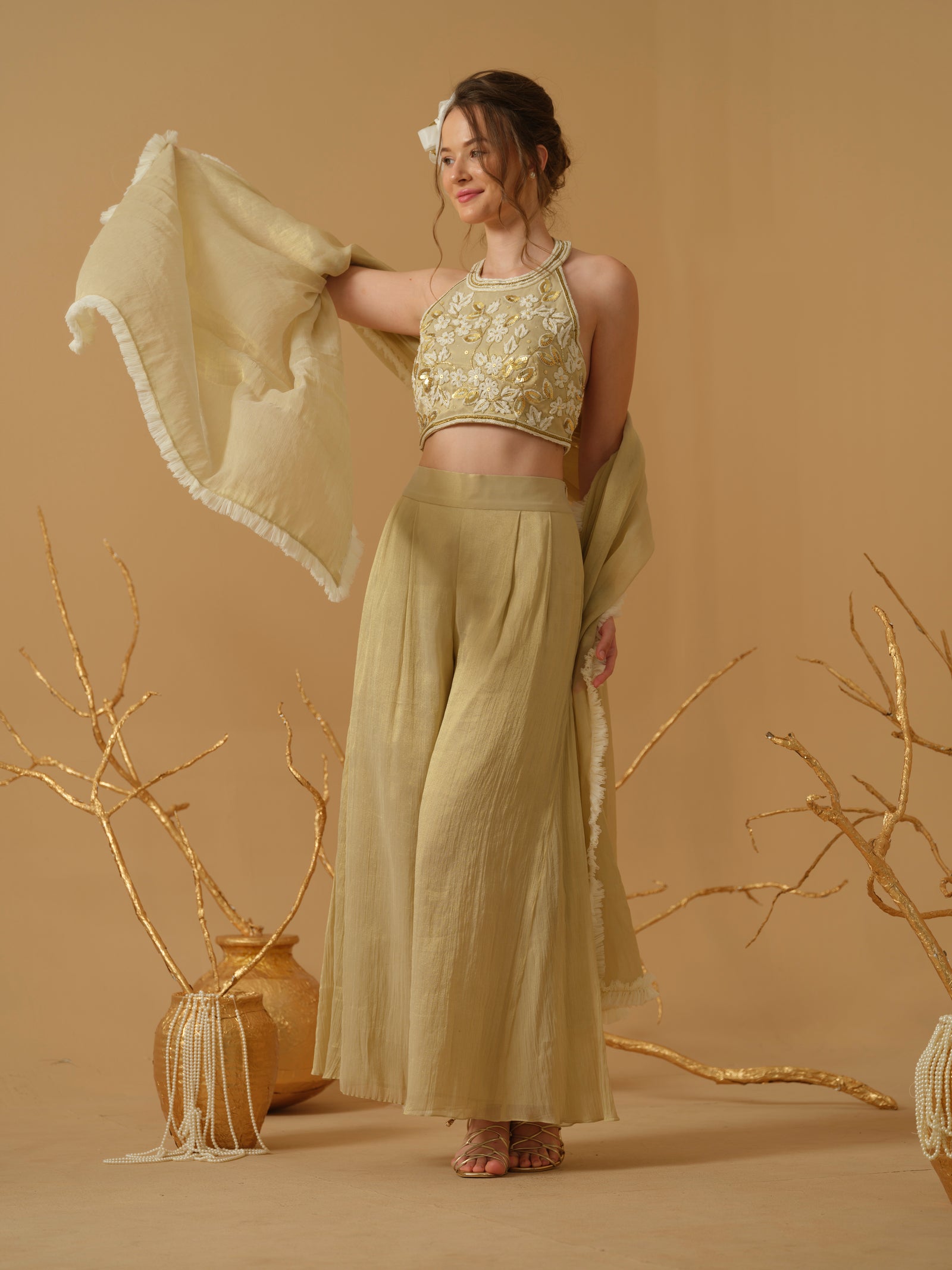 A Halter Neck Blouse Having  Floral Embroidery  Paired With Culotte Pant