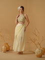 A  Halter Neck Blouse Having  Floral Embroidery  Paired With Draped Skirt