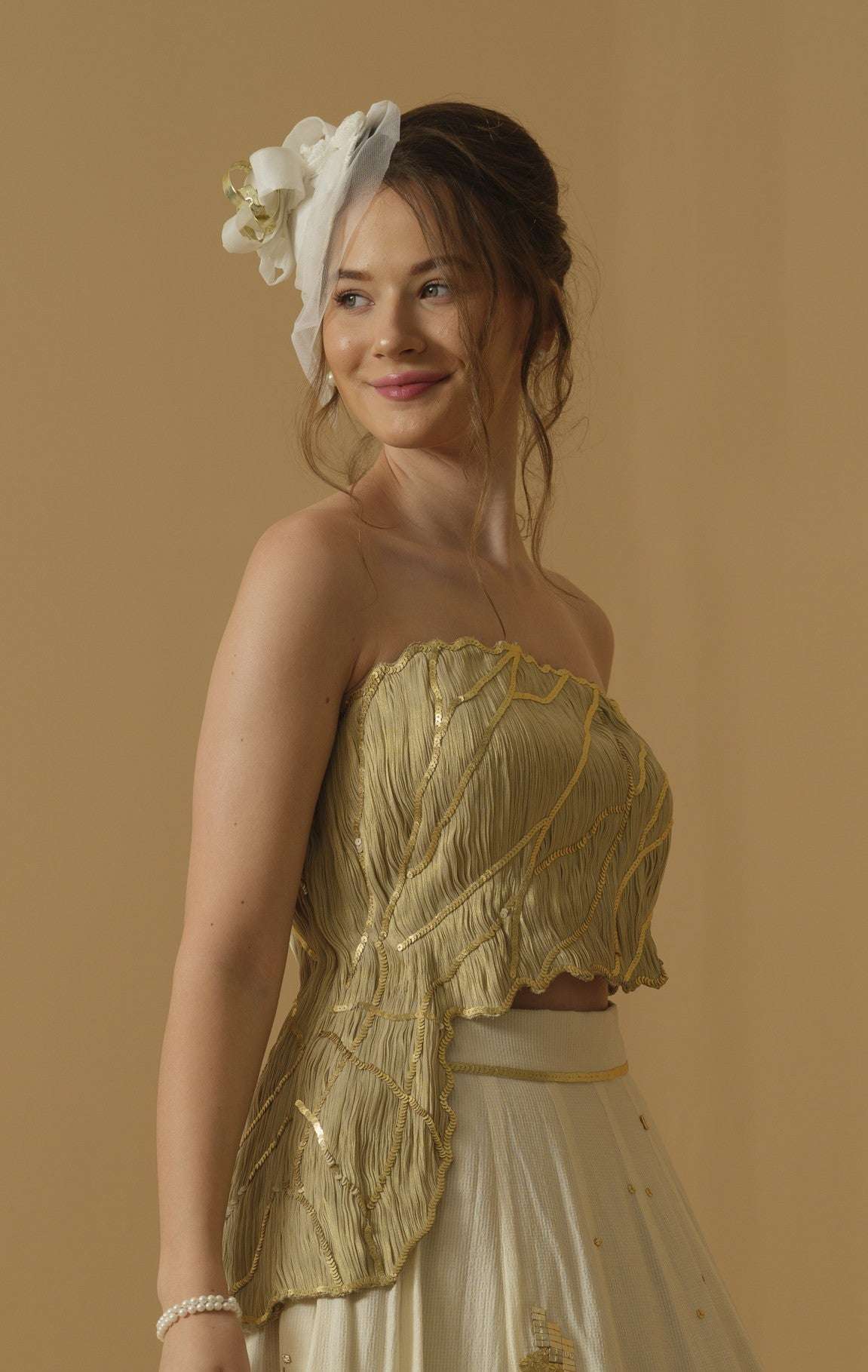 An Asymmetrical Ruched Tube Top