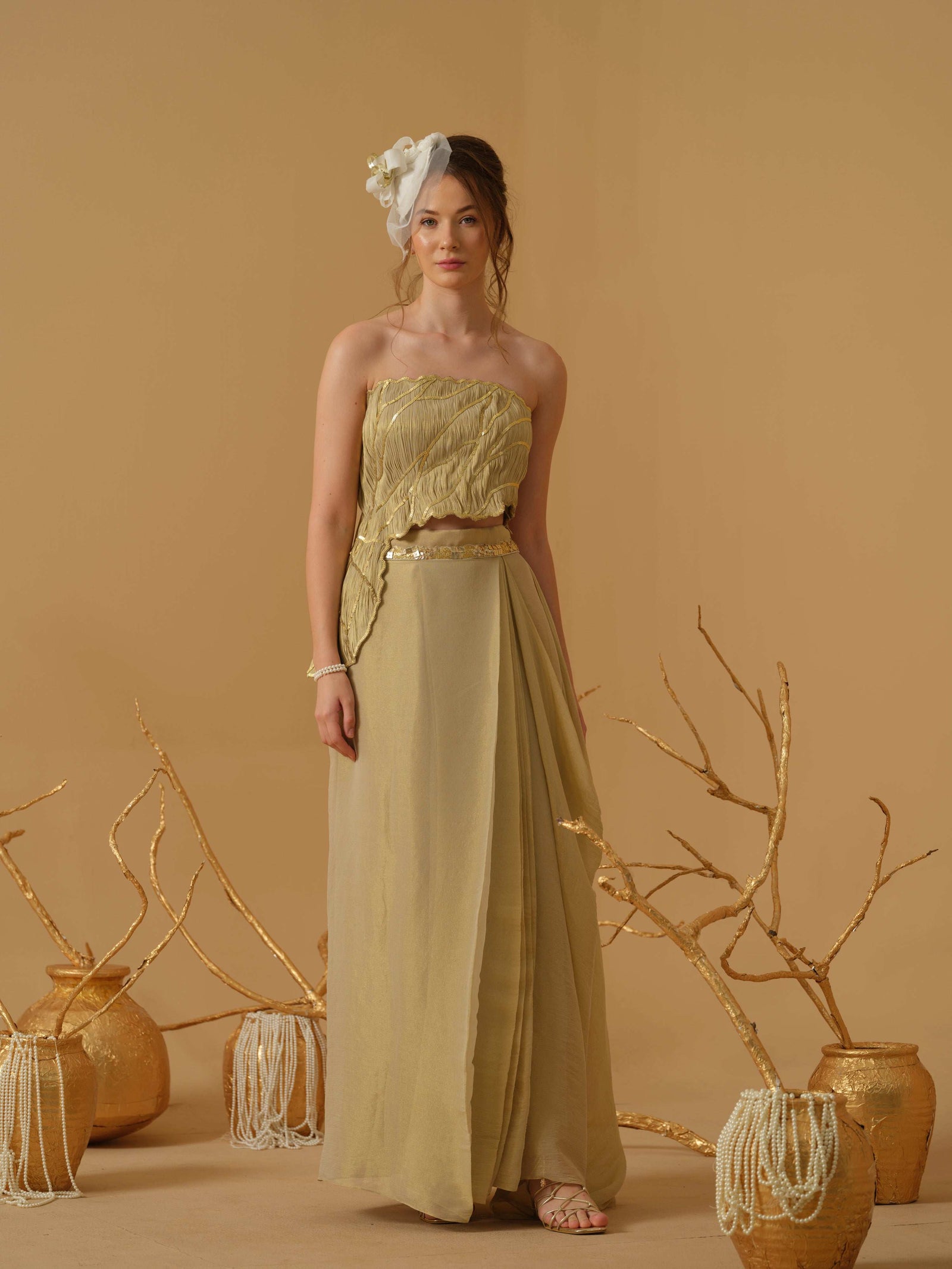 Featuring An Asymmetrical Ruched Tube Top