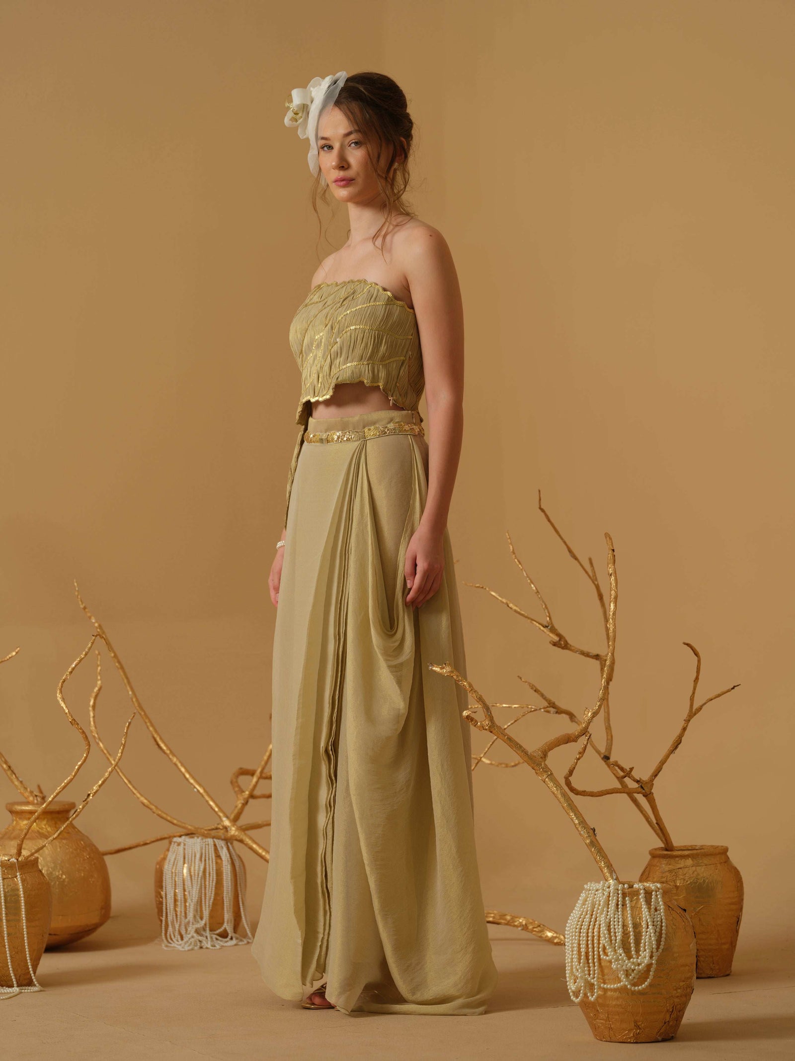 Featuring An Asymmetrical Ruched Tube Top