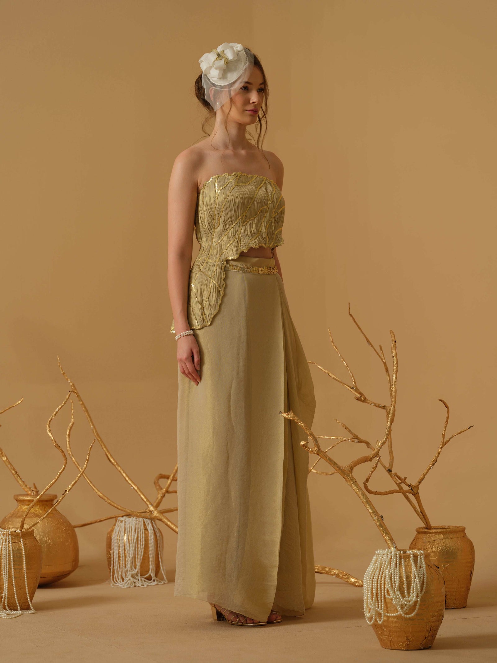 Featuring An Asymmetrical Ruched Tube Top