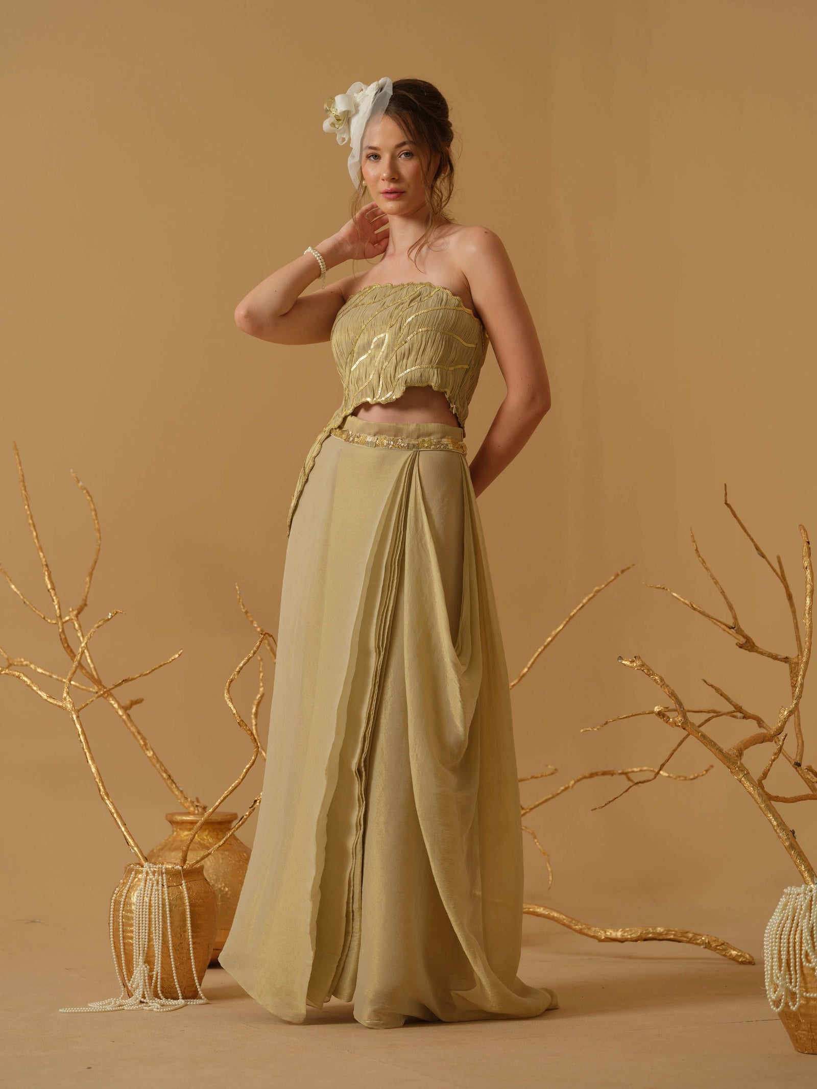 Featuring An Asymmetrical Ruched Tube Top