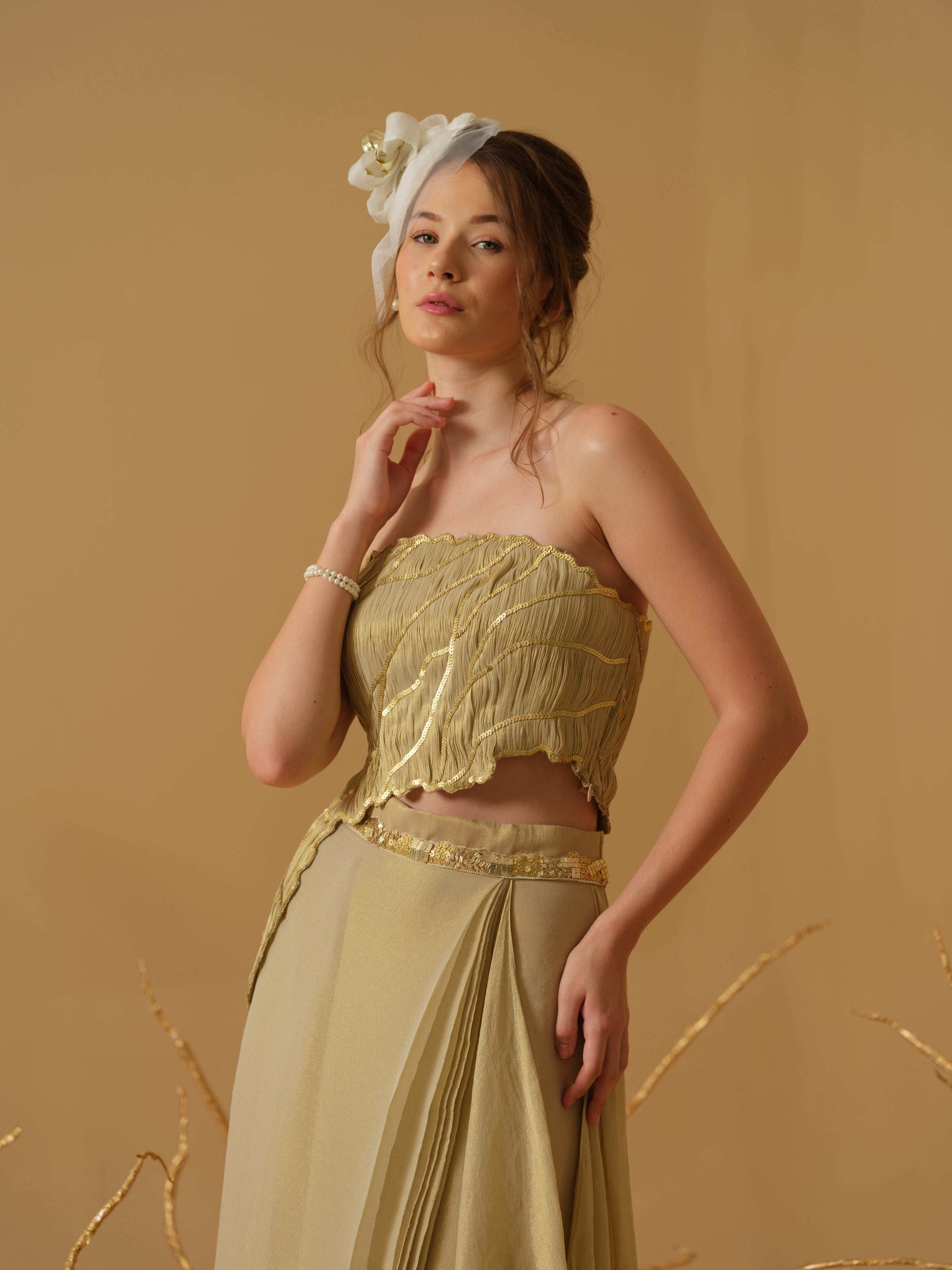 Featuring An Asymmetrical Ruched Tube Top