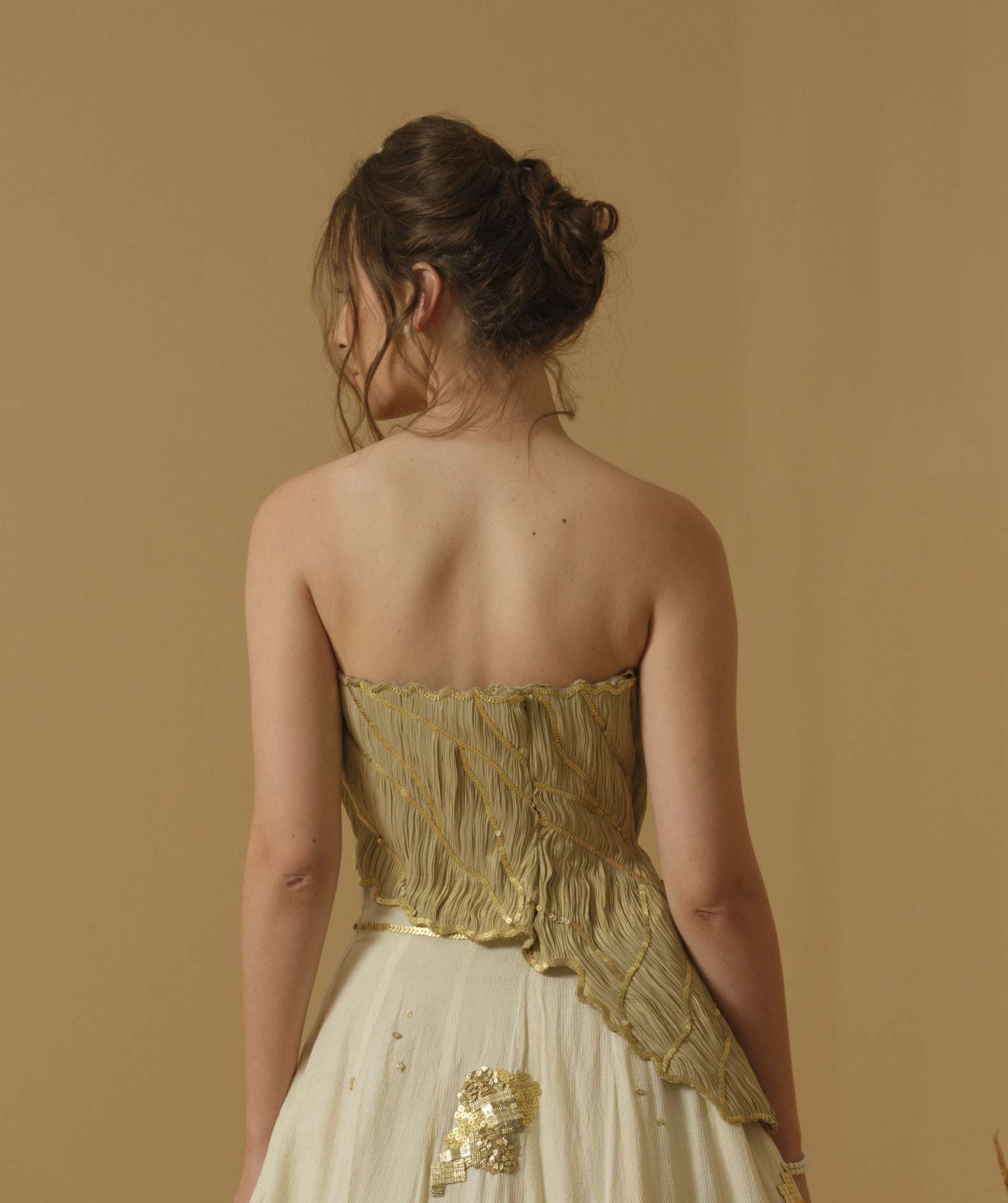 An Asymmetrical Ruched Tube Top