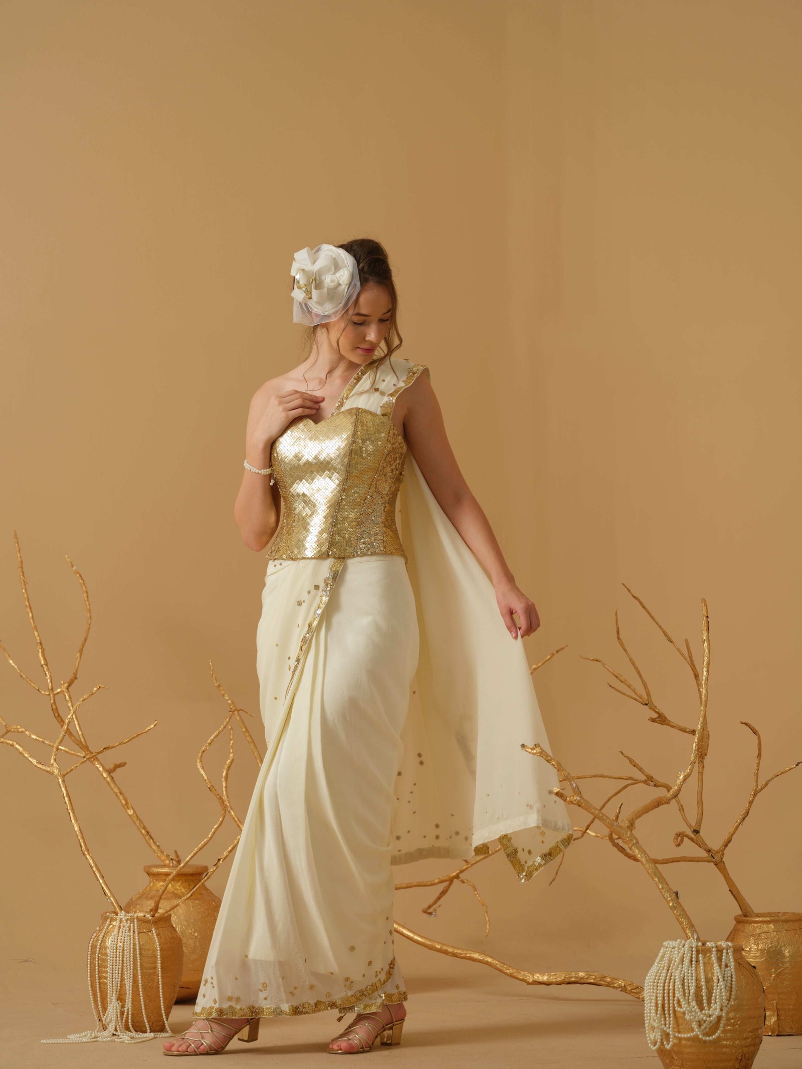 A Pre-Stitched Saree With A Geometrical Sequins Border Paired With A Heavily Embellished Corset