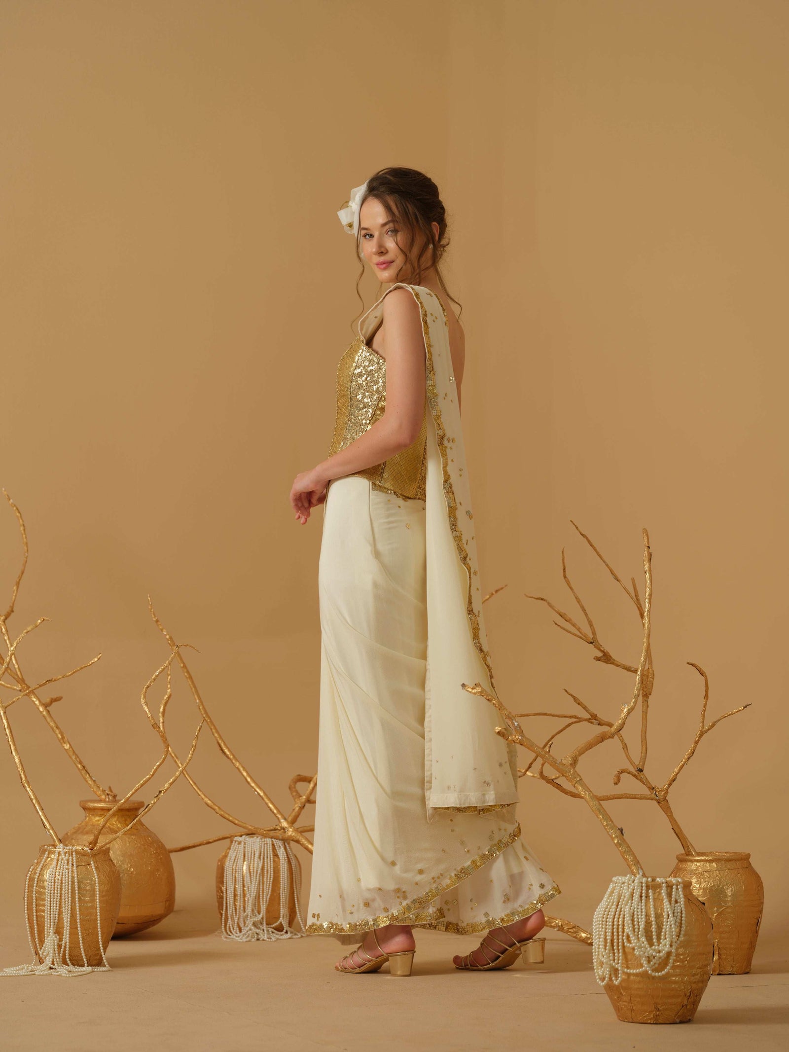 A Pre-Stitched Saree With A Geometrical Sequins Border Paired With A Heavily Embellished Corset