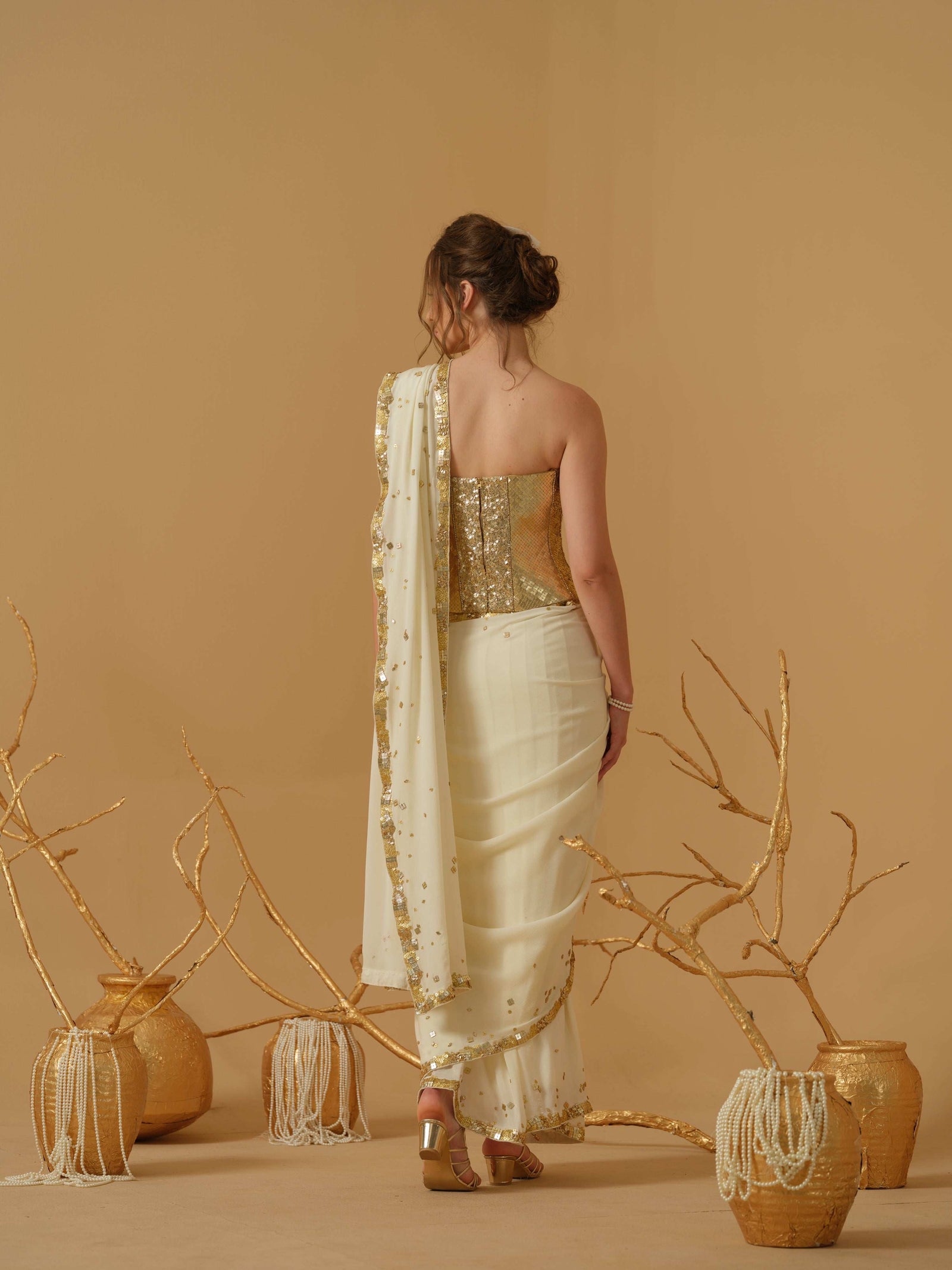 Featuring A Pre-Stitched Saree With A Geometrical Sequins Border