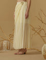 Draped Skirt With Slit Having A Brooch On The Side Of The Waist