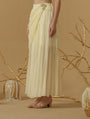 Draped Skirt With Slit Having A Brooch On The Side Of The Waist