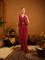 A three-piece set — jacket, bustier, and drape skirt
