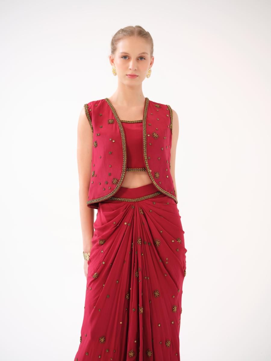 A three-piece set — jacket, bustier, and drape skirt