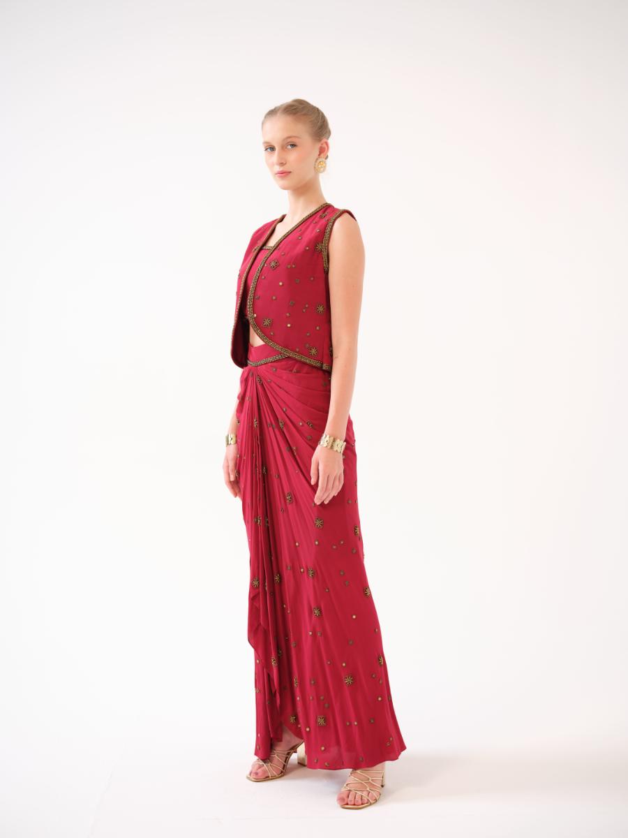 A three-piece set — jacket, bustier, and drape skirt