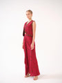 A three-piece set — jacket, bustier, and drape skirt