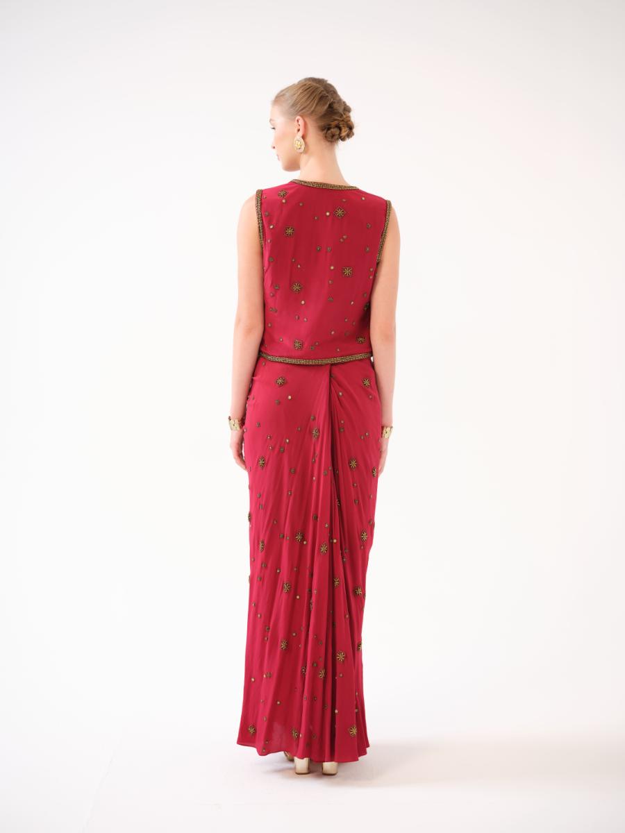 A three-piece set — jacket, bustier, and drape skirt