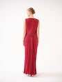 A three-piece set — jacket, bustier, and drape skirt