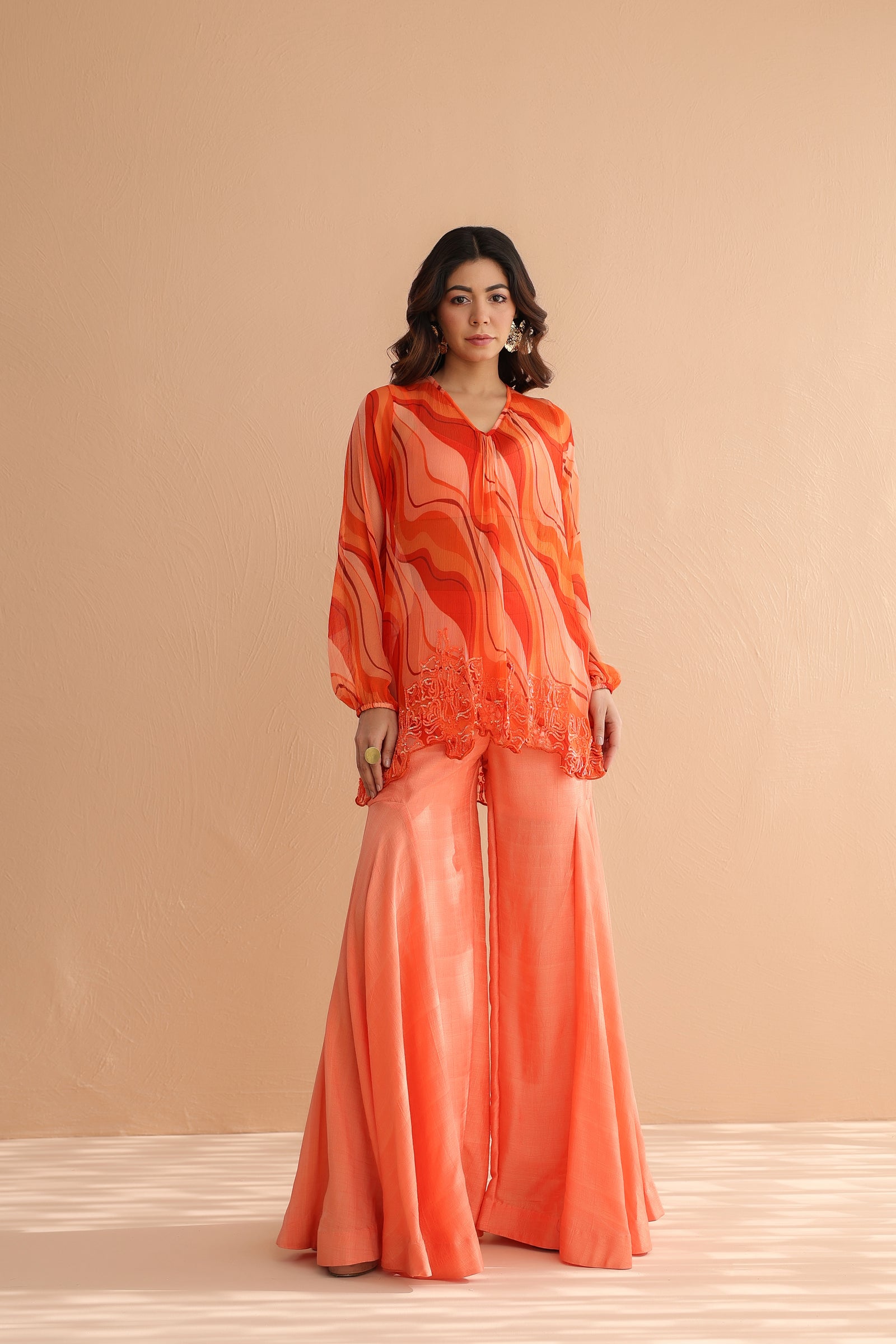 Tequila sunrise tunic with exaggerated bell-bottoms.