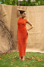 An Orange Knit Dress, Adorned With Hand Embrodiered