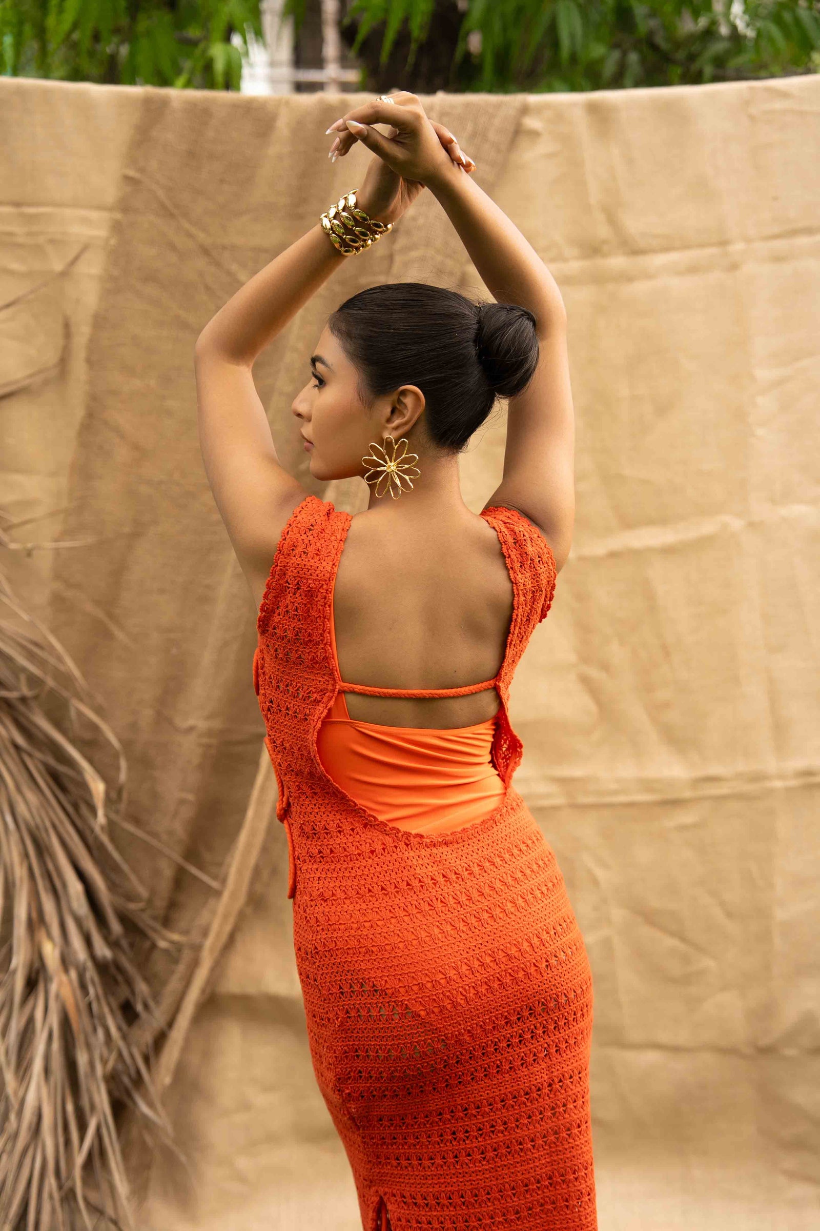 An Orange Knit Dress, Adorned With Hand Embrodiered