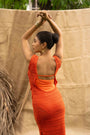 An Orange Knit Dress, Adorned With Hand Embrodiered