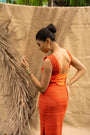 An Orange Knit Dress, Adorned With Hand Embrodiered