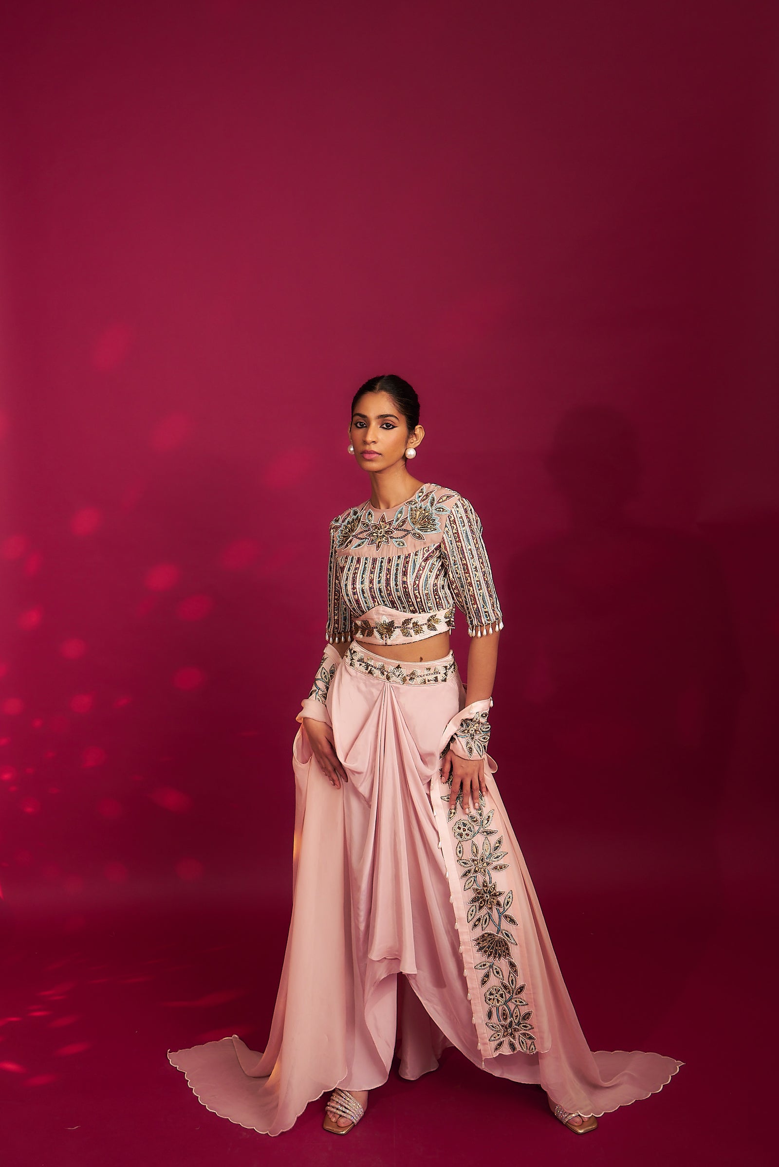 Peachy pink embellished ajrakh blouse with embroidered cape and dhoti