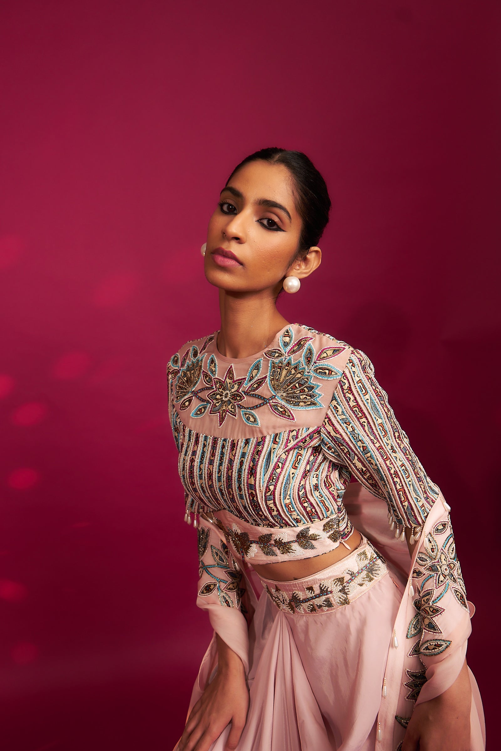 Peachy pink embellished ajrakh blouse with embroidered cape and dhoti