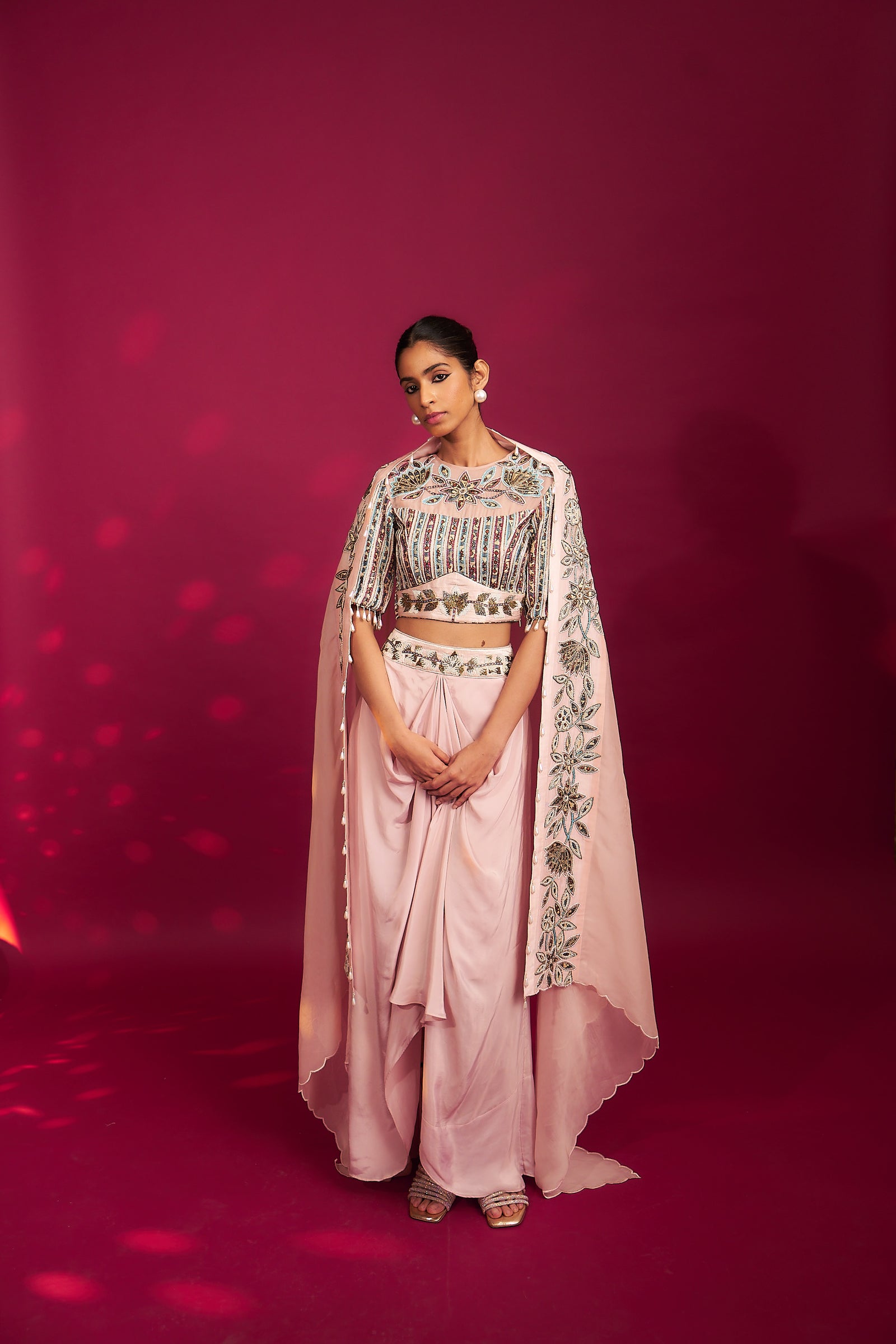 Peachy pink embellished ajrakh blouse with embroidered cape and dhoti