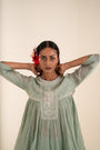 An Ocean Blue Peplum Set Embellished With Hand-Embroidery