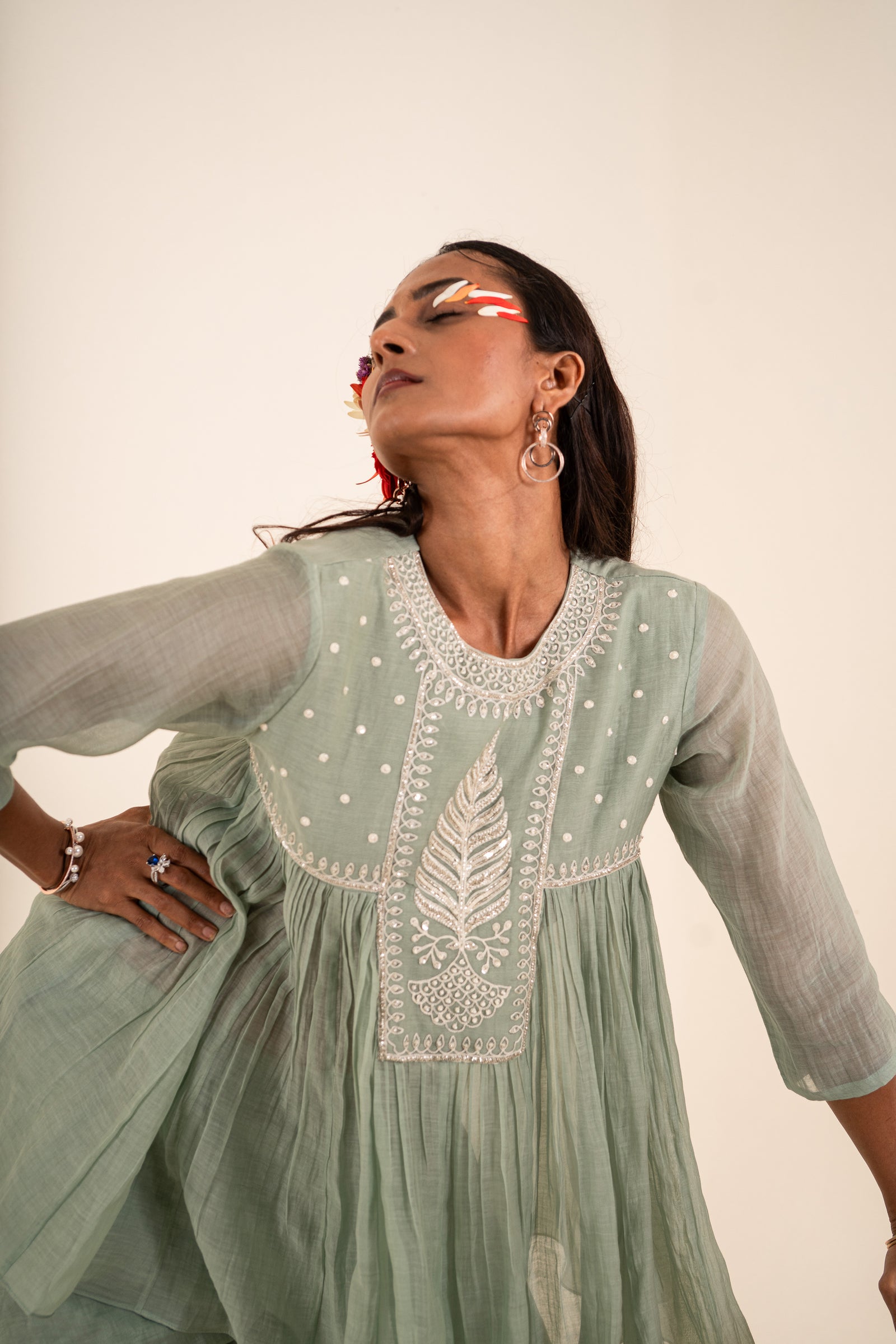 An Ocean Blue Peplum Set Embellished With Hand-Embroidery